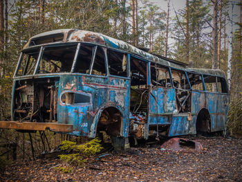 Abandoned car in forest