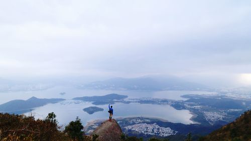 Scenic view of mountains against cloudy sky