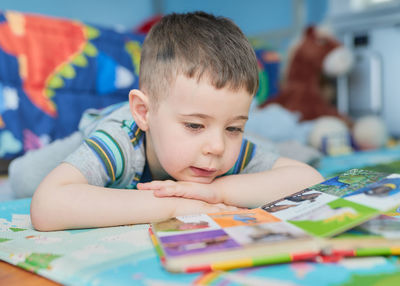 Close-up of cute boy looking at home