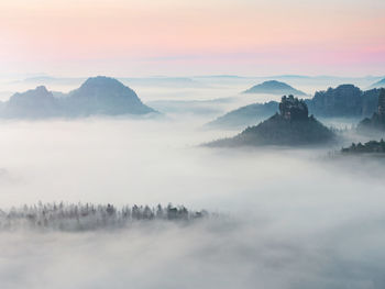 Scenic view of mountains against sky during sunset