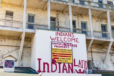 Low angle view of text on building