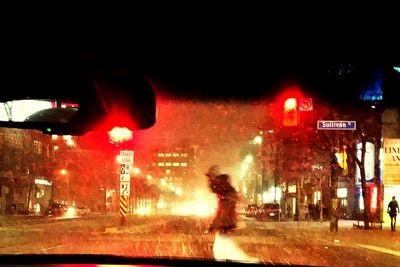 People walking on road at night