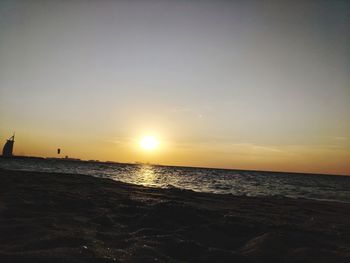 View of beach at sunset