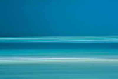 Scenic view of sea against blue sky