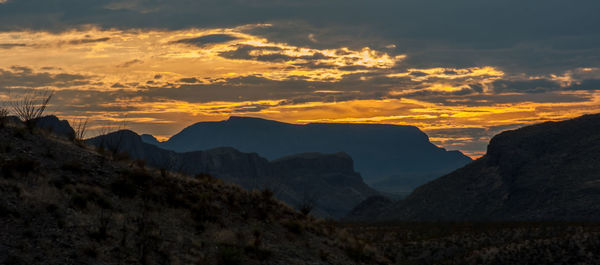 Scenic view of mountains against sky during sunset