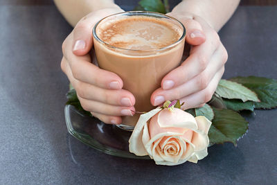 Close-up of woman holding drink