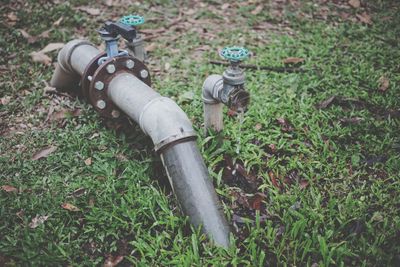 High angle view of pipe on field