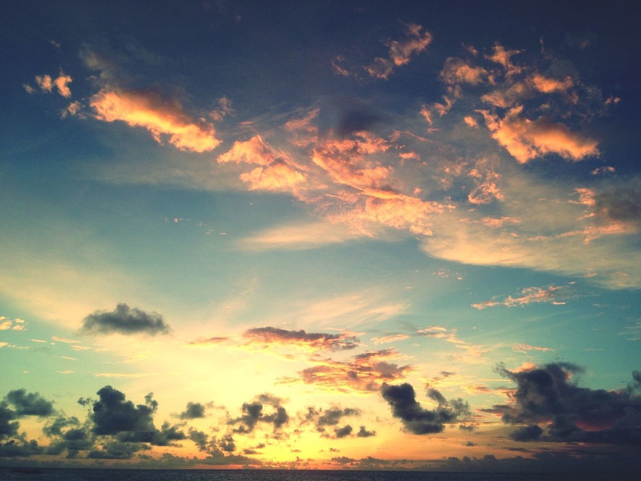 sky, sunset, scenics, cloud - sky, tranquility, beauty in nature, tranquil scene, nature, low angle view, idyllic, cloudy, silhouette, cloud, orange color, cloudscape, dramatic sky, majestic, outdoors, sky only, moody sky