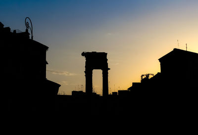 Low angle view of silhouette buildings against sky during sunset