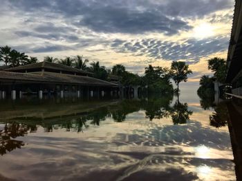 Scenic view of lake against sky at sunset