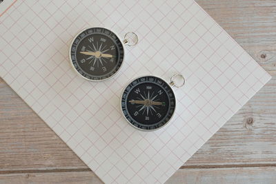 High angle view of clock on table