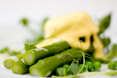 Close-up of asparagus and hollandaise sauce