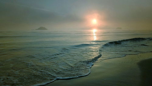 Scenic view of sea against sky during sunset