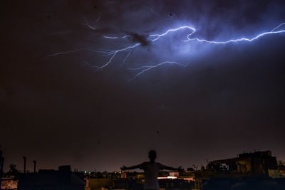 Lightning over city at night