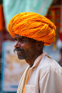 Close-up portrait of a man looking away