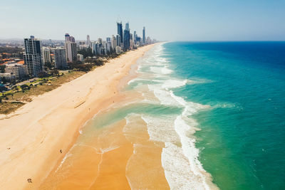 Scenic view of sea and buildings against sky