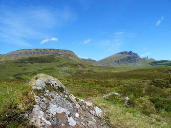 Scenic view of landscape against blue sky