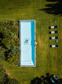 Aerial view of woman swimming in pool