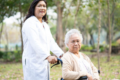 Portrait of a smiling young woman standing outdoors