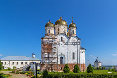 Low angle view of church against clear blue sky