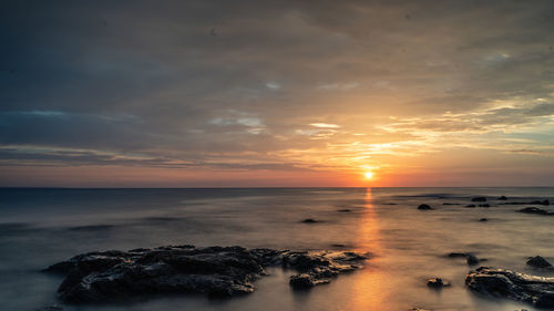 Scenic view of sea against sky during sunset