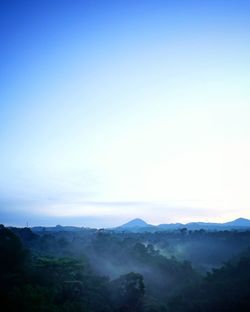 Scenic view of mountains against clear blue sky