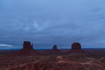 View of rock formations against cloudy sky