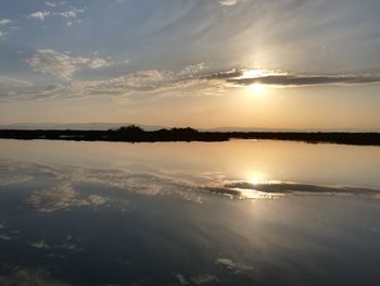 Scenic view of lake against sky during sunset