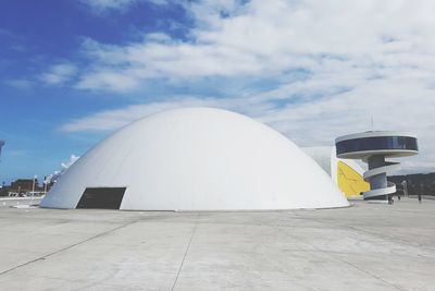 White building against cloudy sky