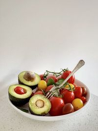 Close-up of fruits on table against white background