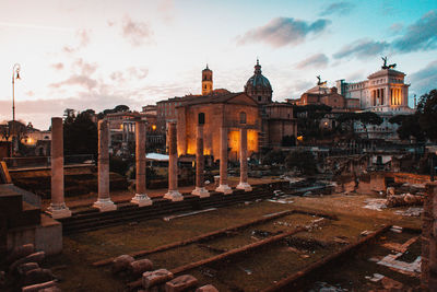 View of old building against sky at sunset
