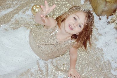 Portrait of smiling girl wearing dress during celebration