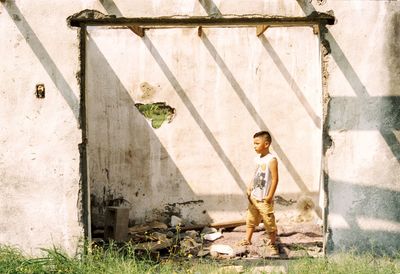 Full length portrait of boy standing outdoors