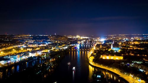 High angle view of illuminated city buildings at night