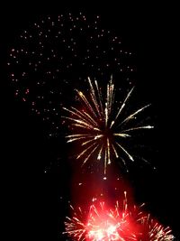 Low angle view of firework display at night