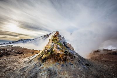 Scenic view of volcanic mountain against sky