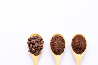 Close-up of coffee beans against white background