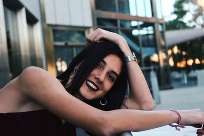 Close-up portrait of smiling young woman