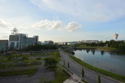 High angle view of river by buildings against sky
