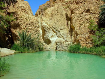 Scenic view of river amidst rock formation