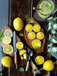 High angle view of drinks with fruits on table