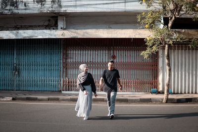 Full length of man walking on street