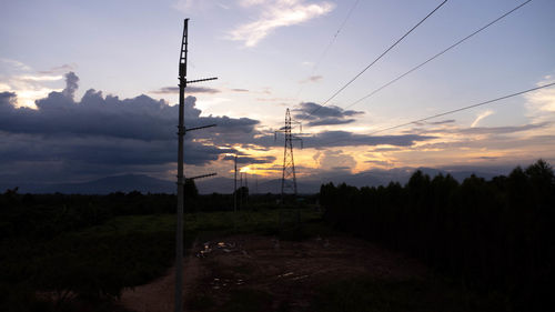 Scenic view of field against sky during sunset