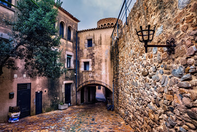 View of alley amidst buildings