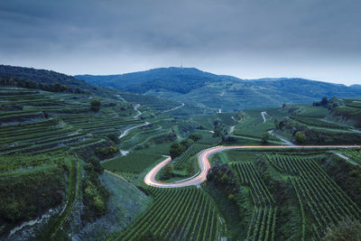 High angle view of agricultural landscape against sky