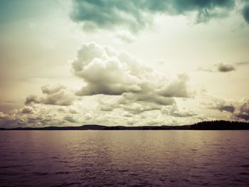 Scenic view of sea against cloudy sky