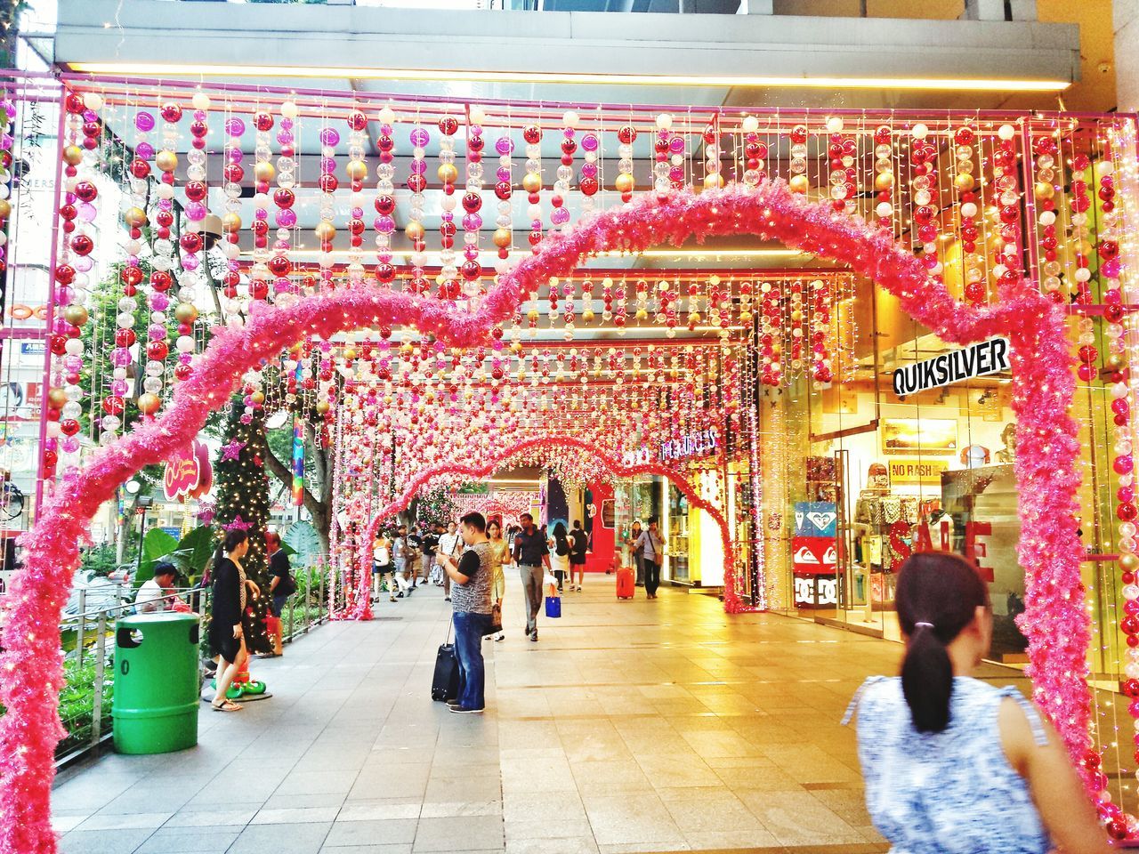 person, retail, market, men, market stall, large group of people, cultures, store, tradition, non-western script, religion, lifestyles, text, illuminated, for sale, shopping, decoration, architecture, built structure