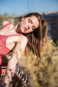 Portrait of young woman in field