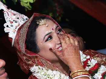 Close-up of smiling bride looking away