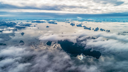 Aerial view of clouds over sea against sky